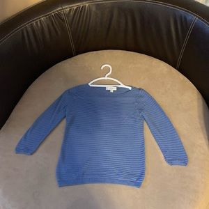 purple woman’s sweater